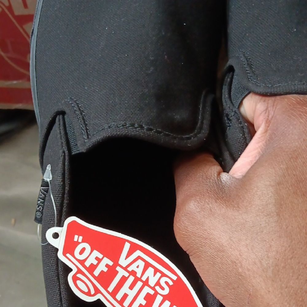 Vans Black Canvas Slip-Ons